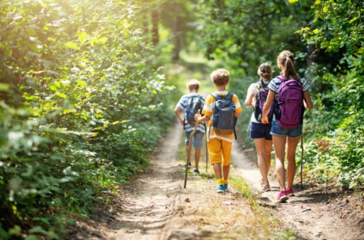 Mother and three kids hiking in forest. Family is having great time together.
Nikon D850